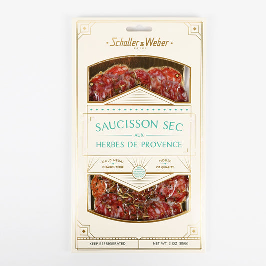 Packaged saucisson sec with herbs de Provence by Schaller & Weber on a white background